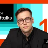Speedtalks podcast cover for episode 18, featuring guest Alex Rud in a black blazer beside the Speednet logo.