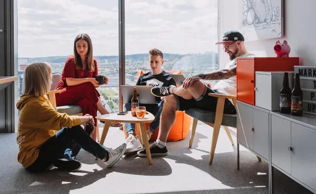 Speednet team members relaxing together in the office lounge.